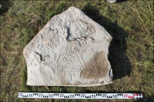 Ornamented stone from the grave (by The Siberian Times)