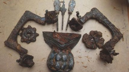 Rich ornamented tin coffin unearthed by cemetery workers