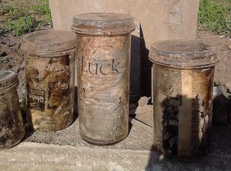 Mysterious glass jars unearthed at cemetery opened and inspected