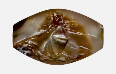 Lime-covered artefact reveals to be an engraved gemstone