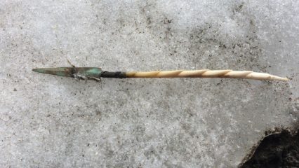 Hunting weapon with copper arrowhead found in melting ice